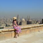 young-female-tourist-enjoying-beautiful-view-ancient-citadel-el-khalifa-egypt_181624-41992