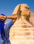 young-tourist-wearing-blue-turban-standing-near-great-sphinx-giza-cairo-egypt_181624-46822